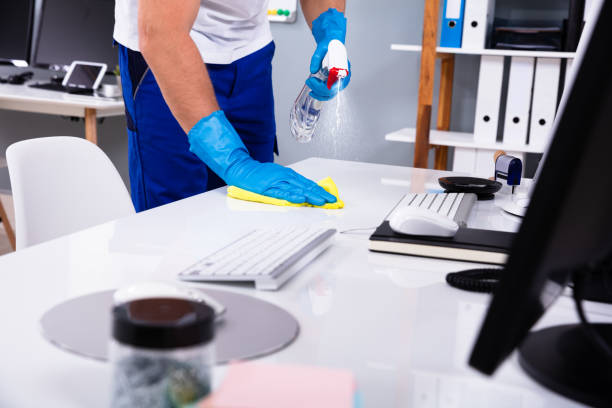 Elite-Detailed-Cleaning-Janitor-cleaning-a-desk-in-an-office