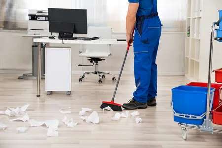 Elite-Detailed-Cleaning-Professional-sweeping-an-office-floor