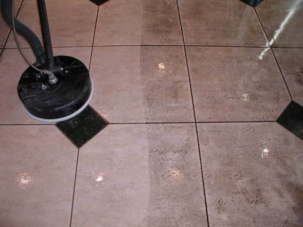 Elite Detailed Cleaning professional using tile washing machine to wash tiles and clean grouts